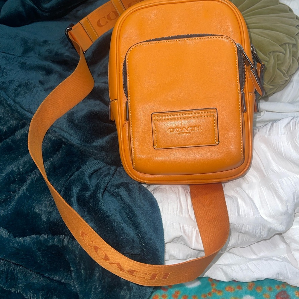 Coach Orange Messenger Bag with Minimalist Design